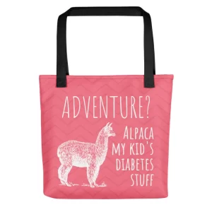Pink bag with a white image of an alpaca. On the bag it says, "Adventure? Alpaca my kid's diabetes stuff"